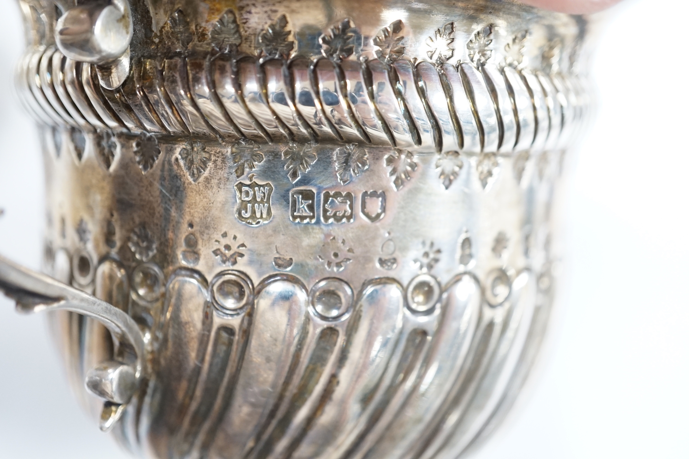 An Edwardian repousse silver porringer, Daniel & John Welby, London, 1905, diameter 92mm, a pair of pierced silver bonbon dishes, one other similar bonbon dish, a silver two handled bowl and a modern silver taste vin